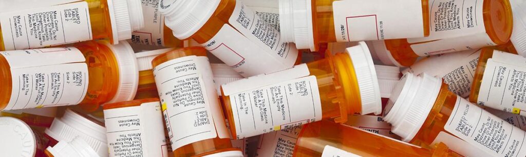 Prescription medication bottles with medications that can cause a false positive on a drug test,